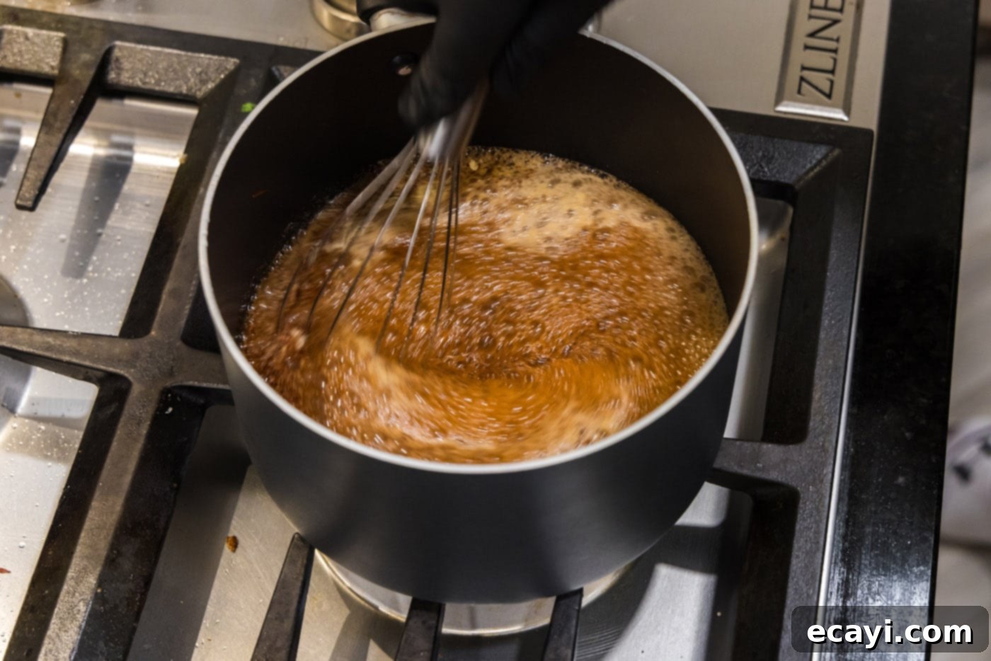 Dr Pepper Infused BBQ Sauce 7 whisking cherry cola barbecue sauce ingredients in a saucepan