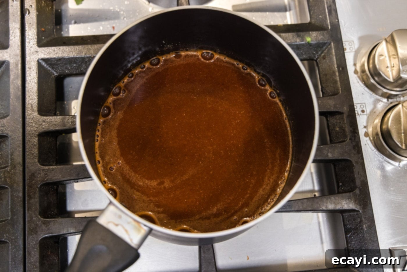 Dr Pepper Infused BBQ Sauce 8 dr. pepper barbecue sauce cooking on the stovetop