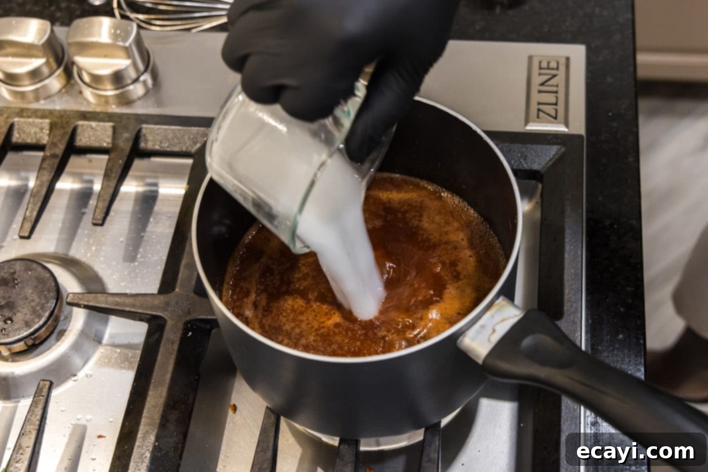 Dr Pepper Infused BBQ Sauce 9 pouring a cornstarch slurry into barbecue sauce