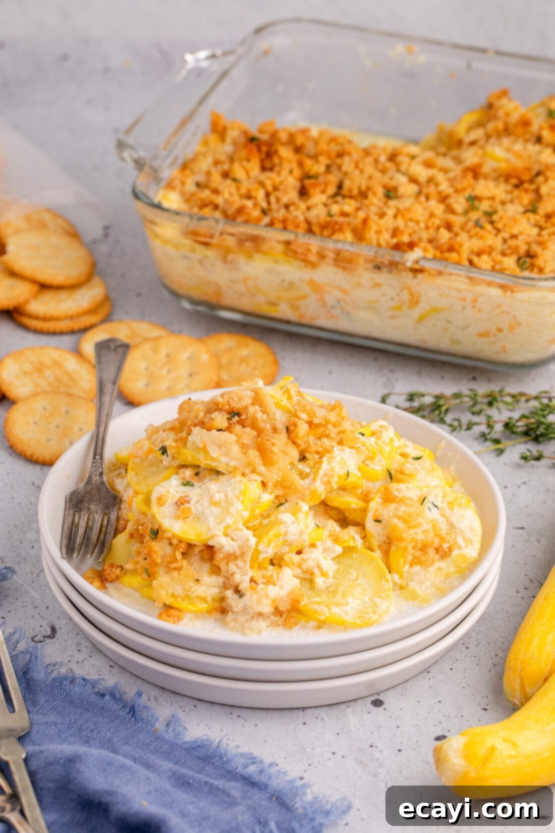 Golden Squash Bake 3 Squash Casserole on a plate with a fork