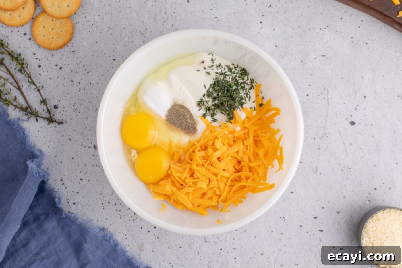 Golden Squash Bake 7 ingredients for yellow squash casserole in a bowl