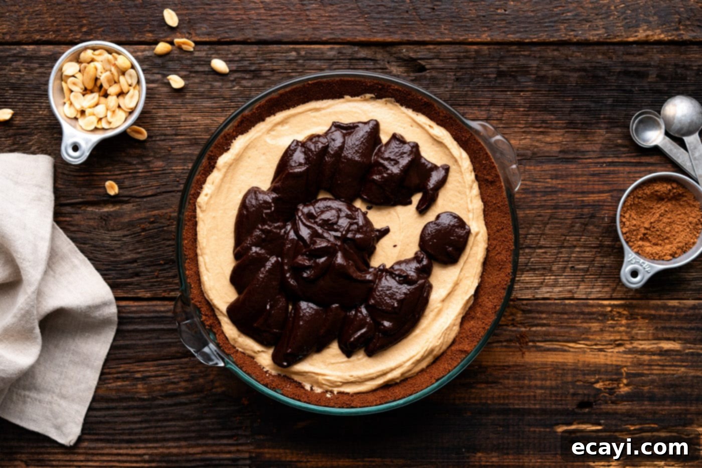 Decadent Peanut Butter Chocolate Dream 14 spreading chocolate ganache over peanut butter pie
