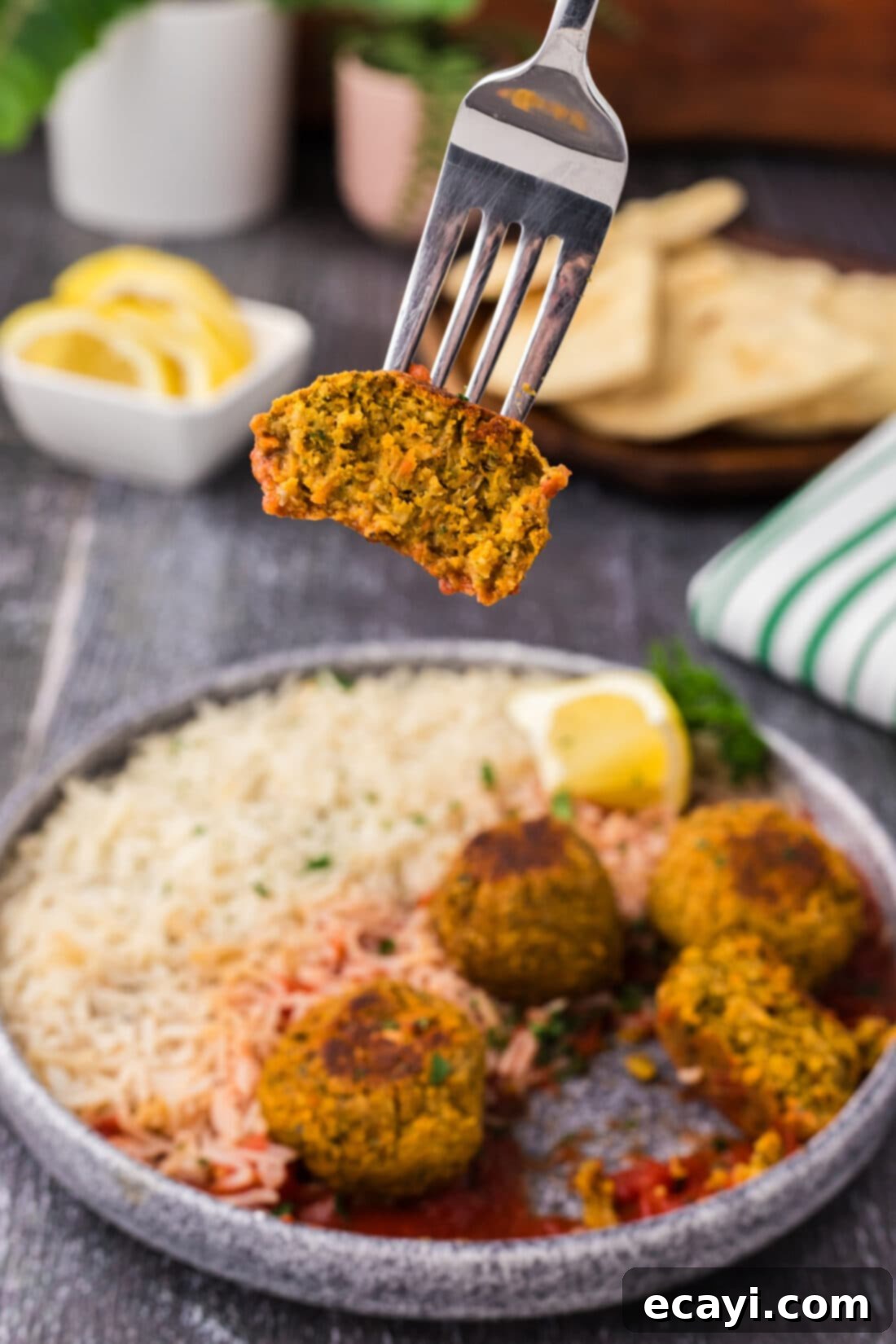 Hearty Lentil Meatballs 14 Half of a Lentil Meatball lifted by a fork