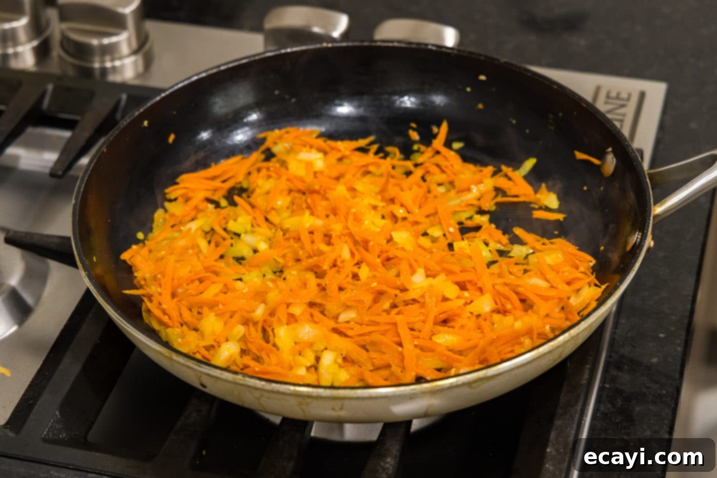 Hearty Lentil Meatballs 6 cooking garlic, onion, and shredded carrots in a skillet