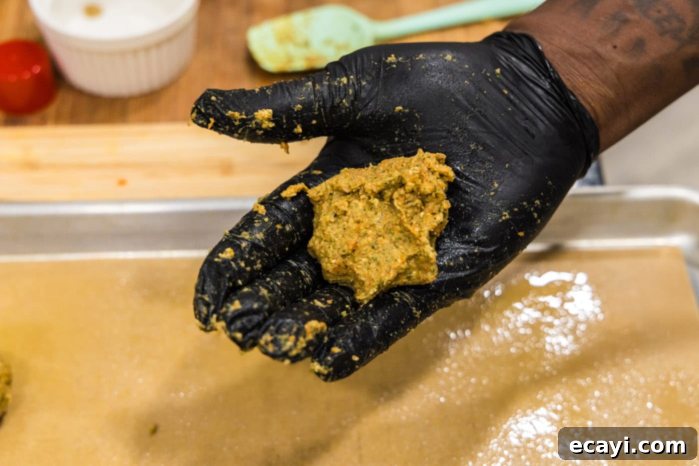 Hearty Lentil Meatballs 10 lentil meatball mixture in palm of hand