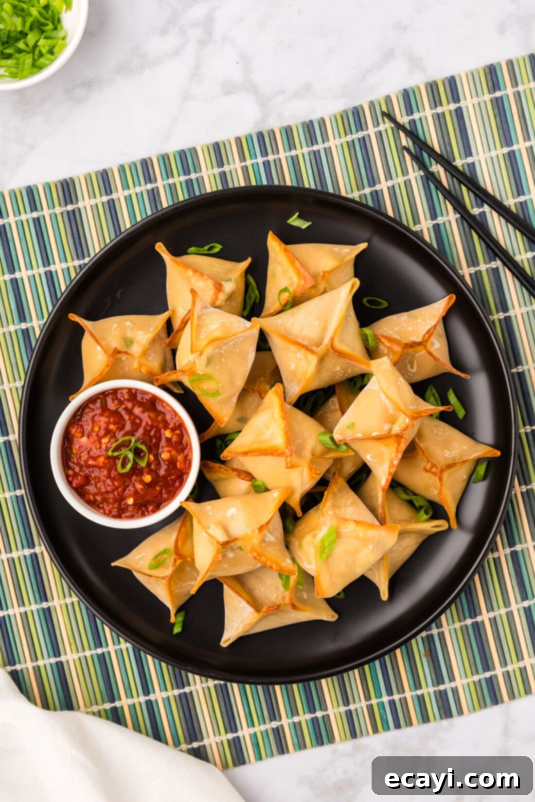 Golden Crab Cream Crisps 12 Overhead photo of a plate of Crab Rangoons