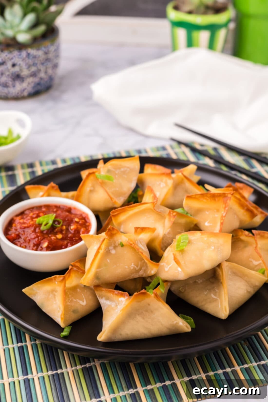 Golden Crab Cream Crisps 3 Crab Rangoons on a plate