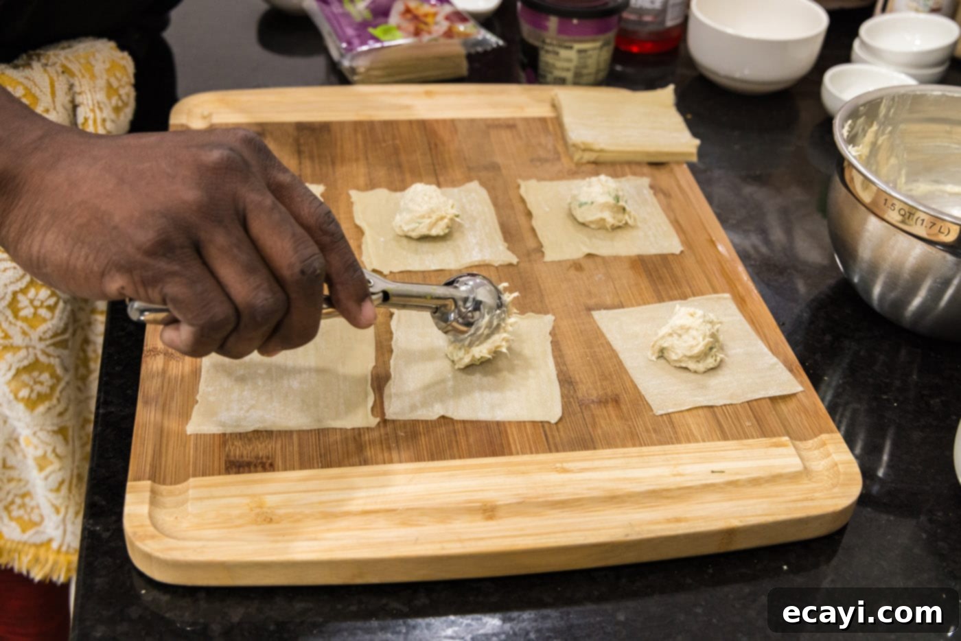 Golden Crab Cream Crisps 7 scooping crab filling into wonton wrappers