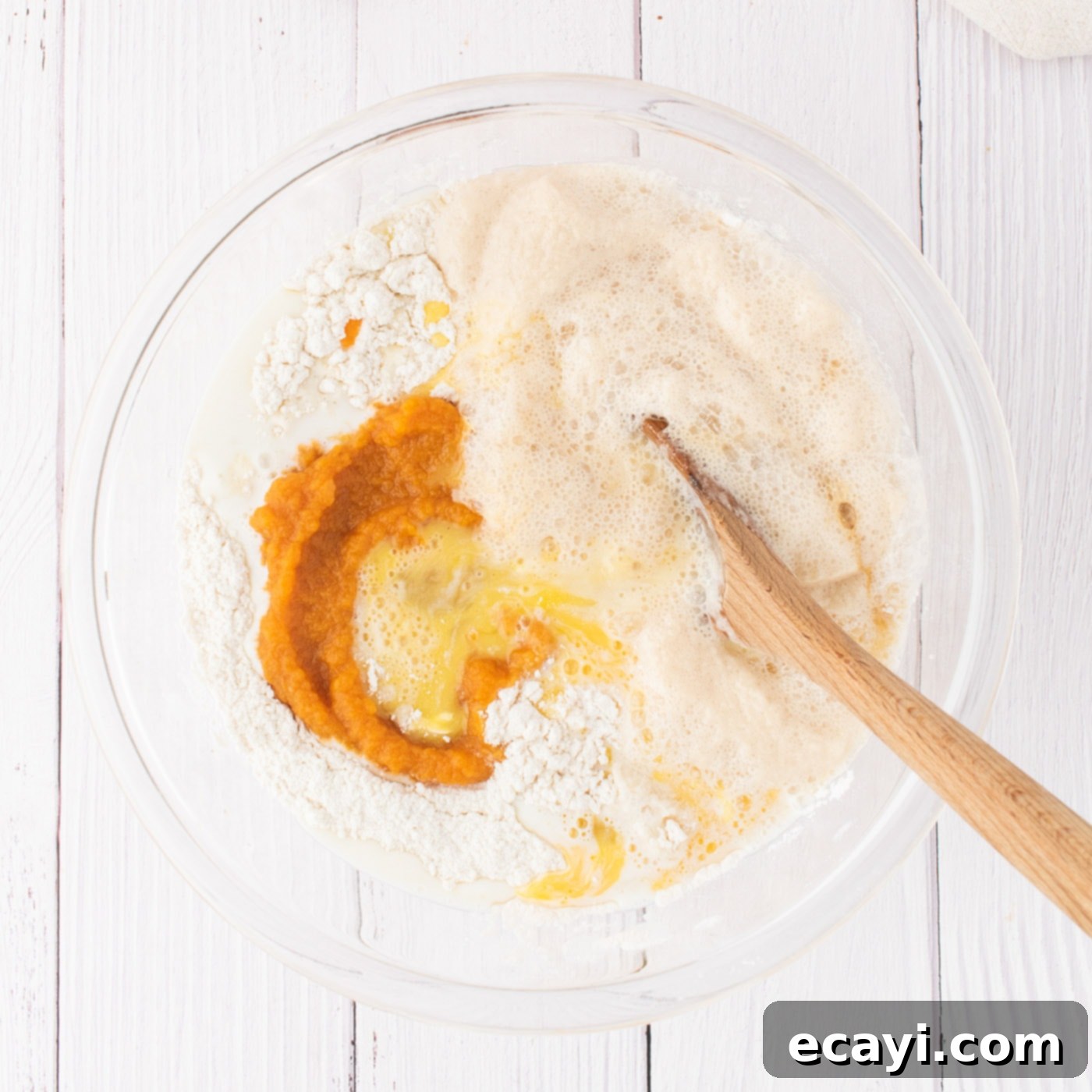 Golden Pumpkin Spiced Swirls 7 mixing butter, eggs, vanilla, pumpkin puree, warm milk, and yeast mixture into dry ingredients