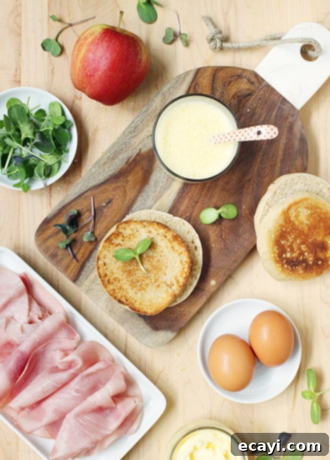 Sunrise Stack: Runny Egg, Maple Ham, Crisp Apple & Velvety Hollandaise 5 Ingredients to Make Runny Egg, Maple Ham, and Crispy Apple Breakfast Sandwich with Blender Hollandaise Sauce // FoodNouveau.com