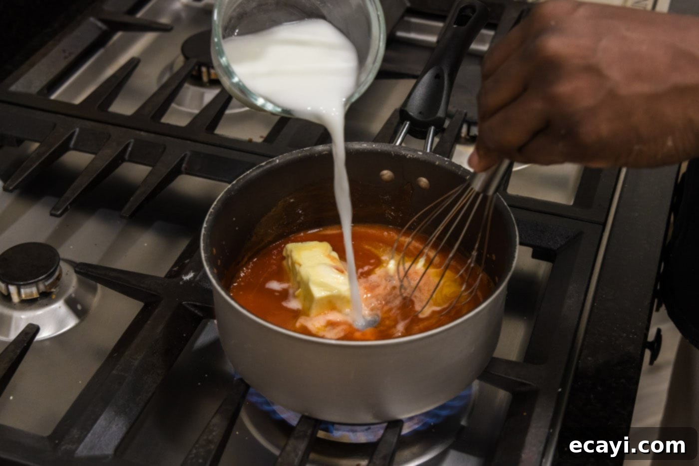 Buffalo Cauliflower Bites 11 whisking a cornstarch slurry into buffalo sauce