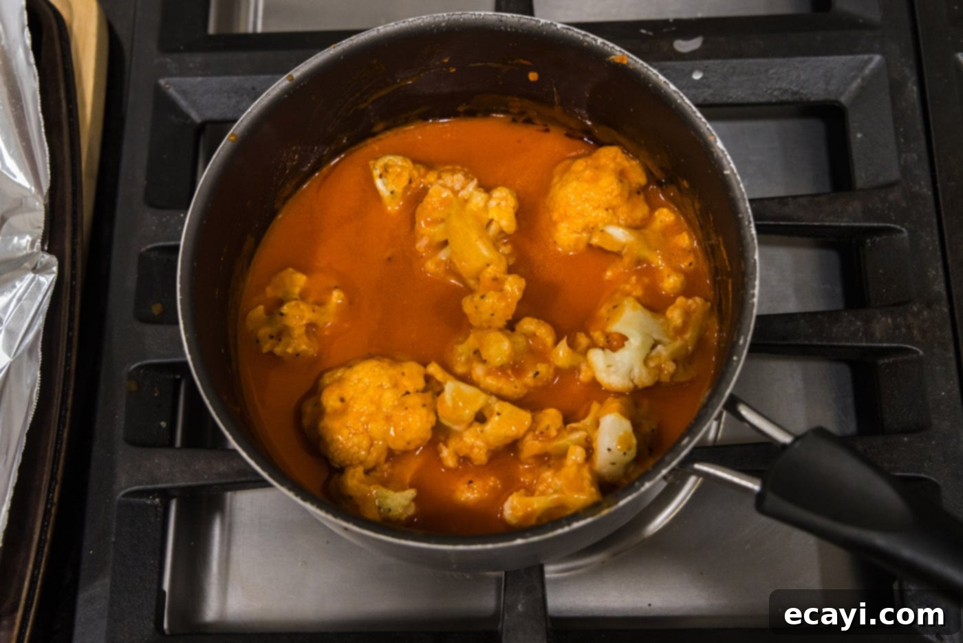 Buffalo Cauliflower Bites 12 tossing cauliflower in buffalo sauce