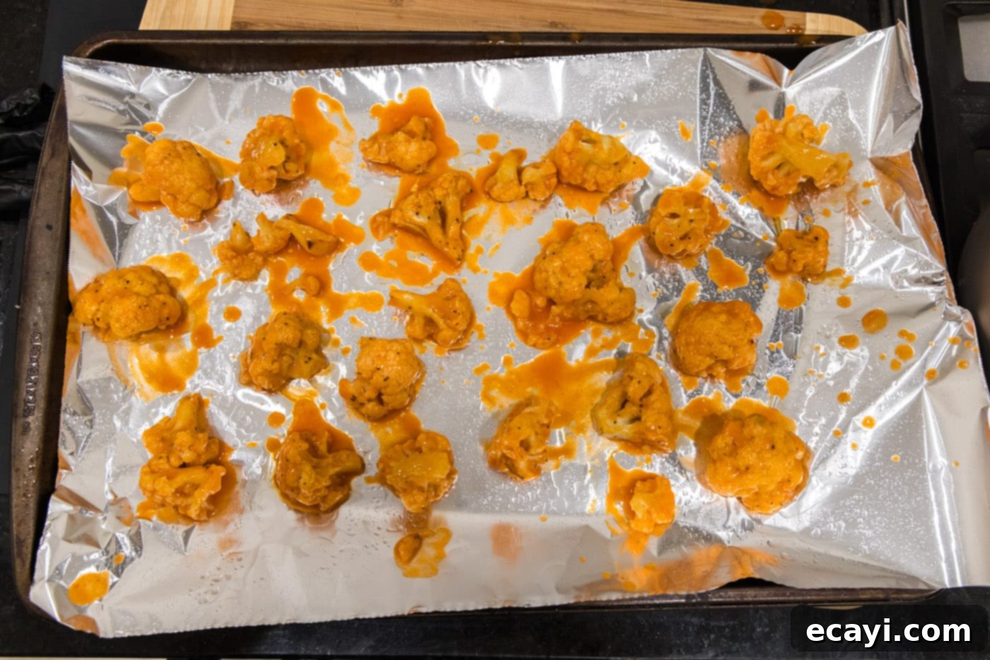 Buffalo Cauliflower Bites 13 buffalo cauliflower on baking sheet