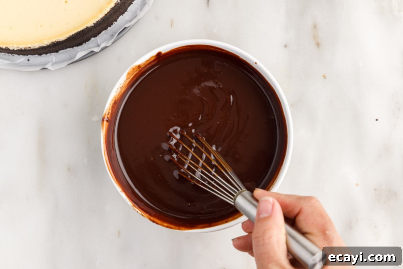 Irresistible Baileys Cheesecake 15 whisking melted chocolate ganache