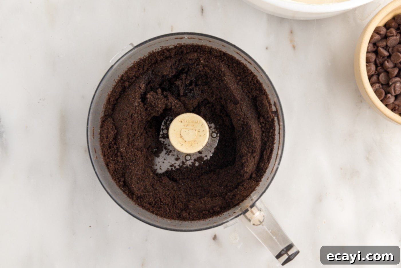 Irresistible Baileys Cheesecake 6 blended Oreo cookies in a food processor