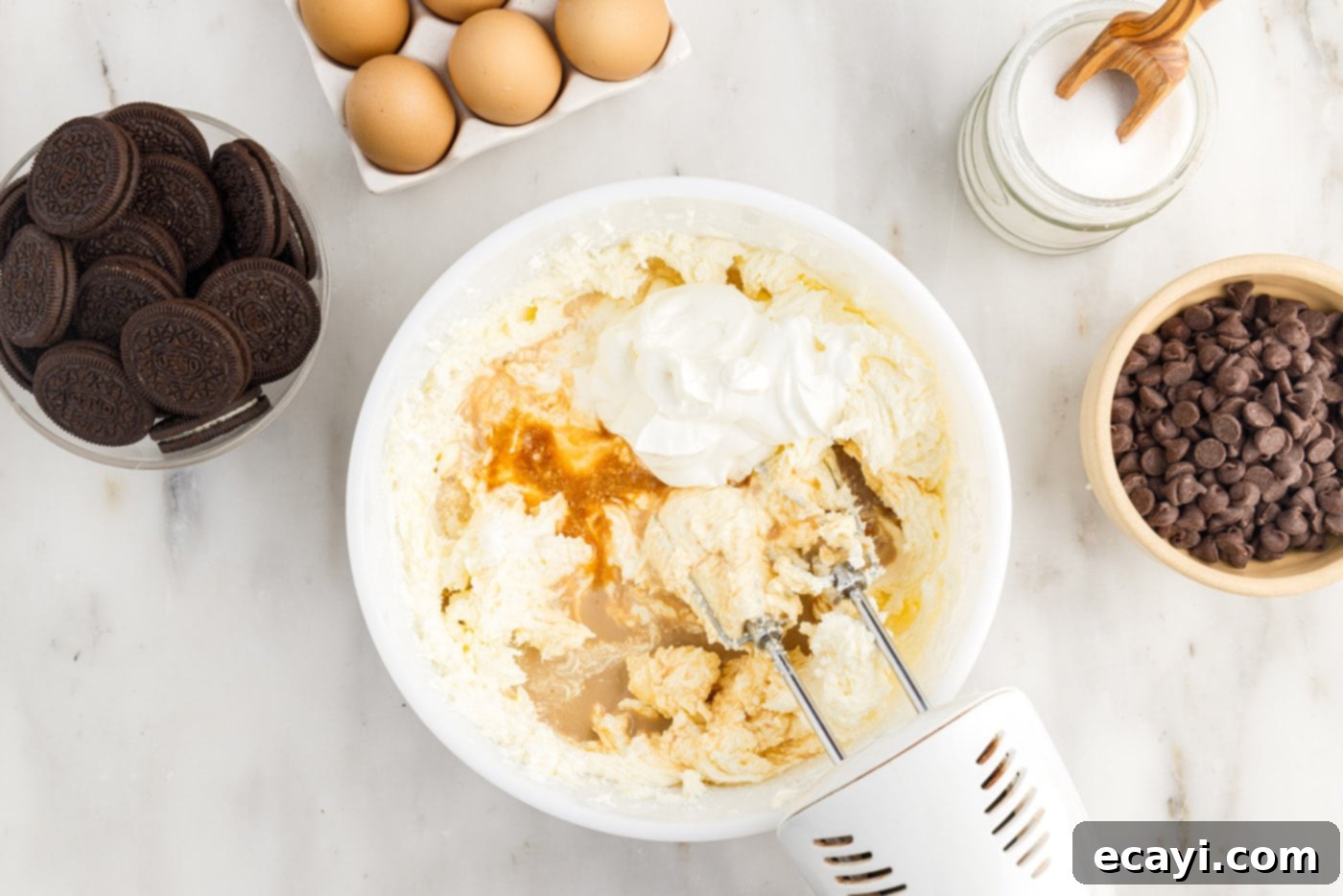 Irresistible Baileys Cheesecake 10 cheesecake ingredients in a mixing bowl
