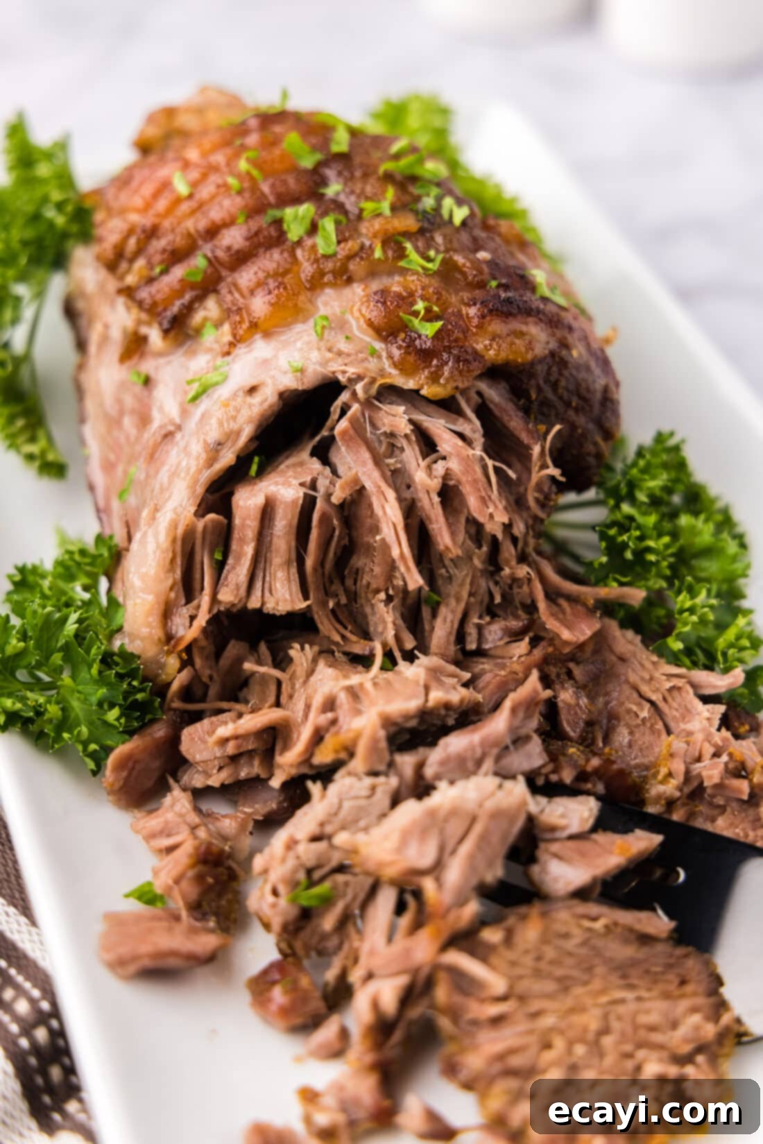 Succulent Lamb Leg Roast 2 Close up photo of a Leg of Lamb on a platter