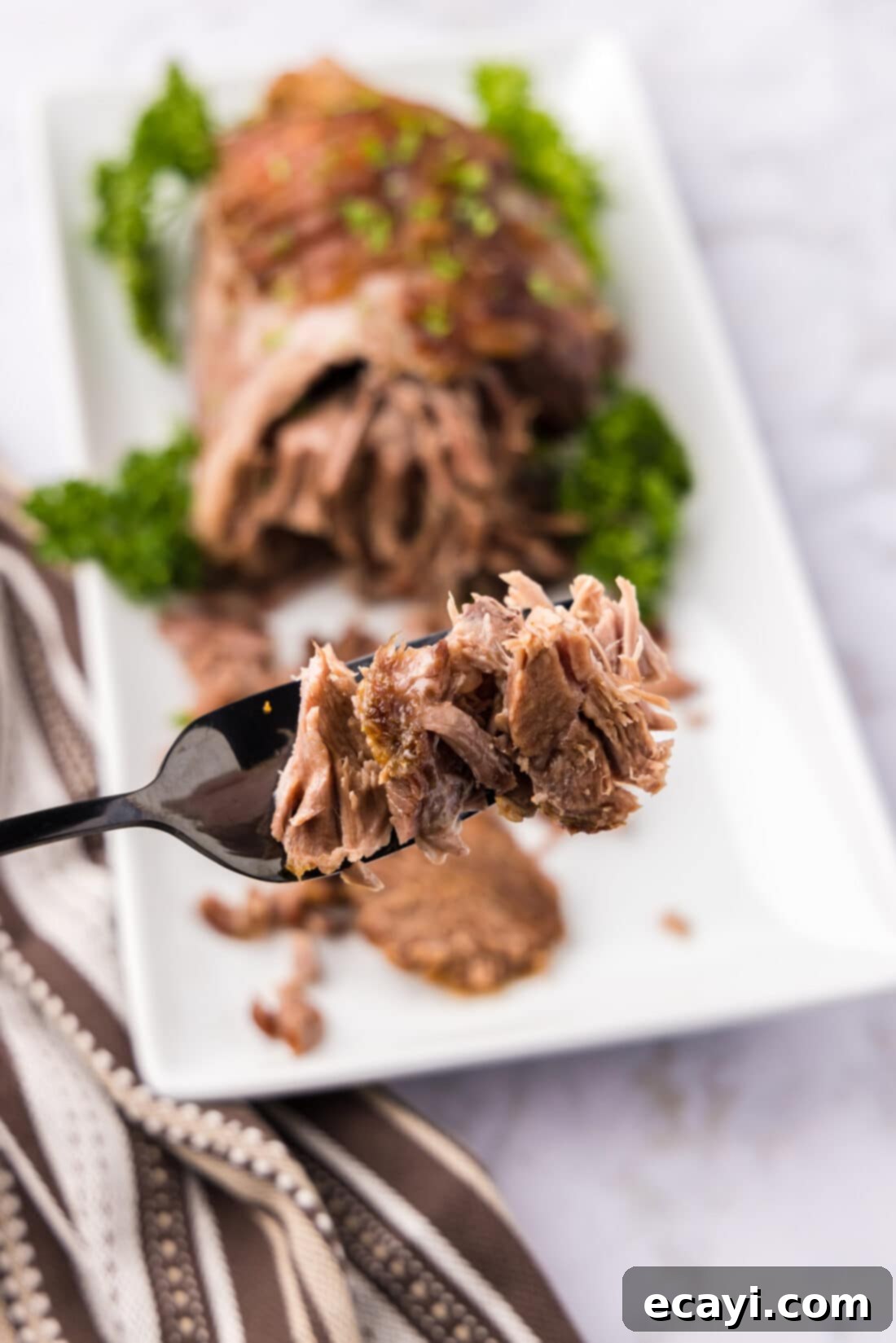 Succulent Lamb Leg Roast 3 Pieces of Leg of Lamb on a fork