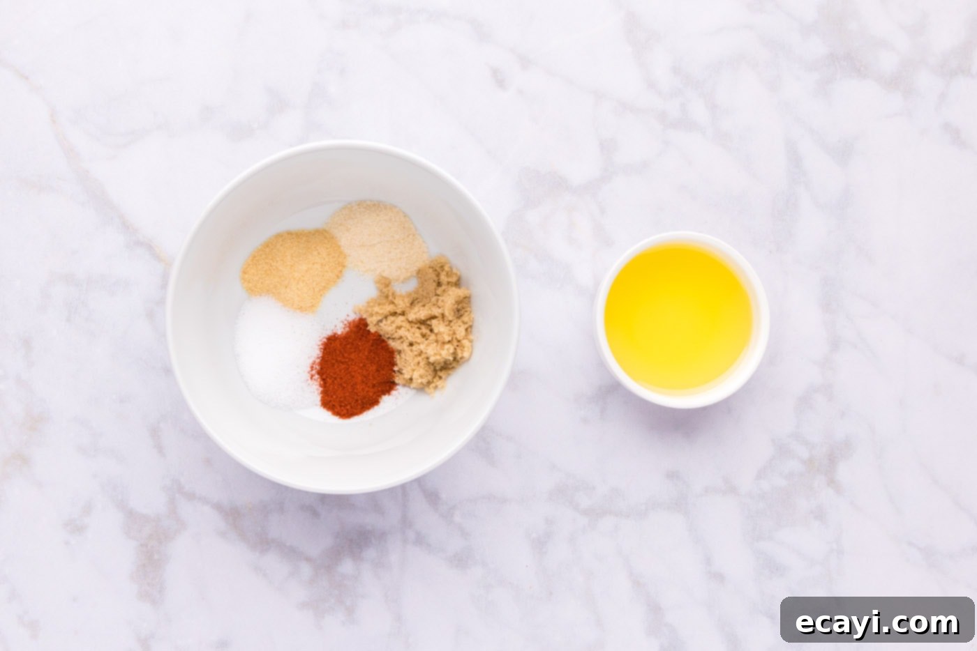 Succulent Lamb Leg Roast 5 seasonings in a bowl next to olive oil
