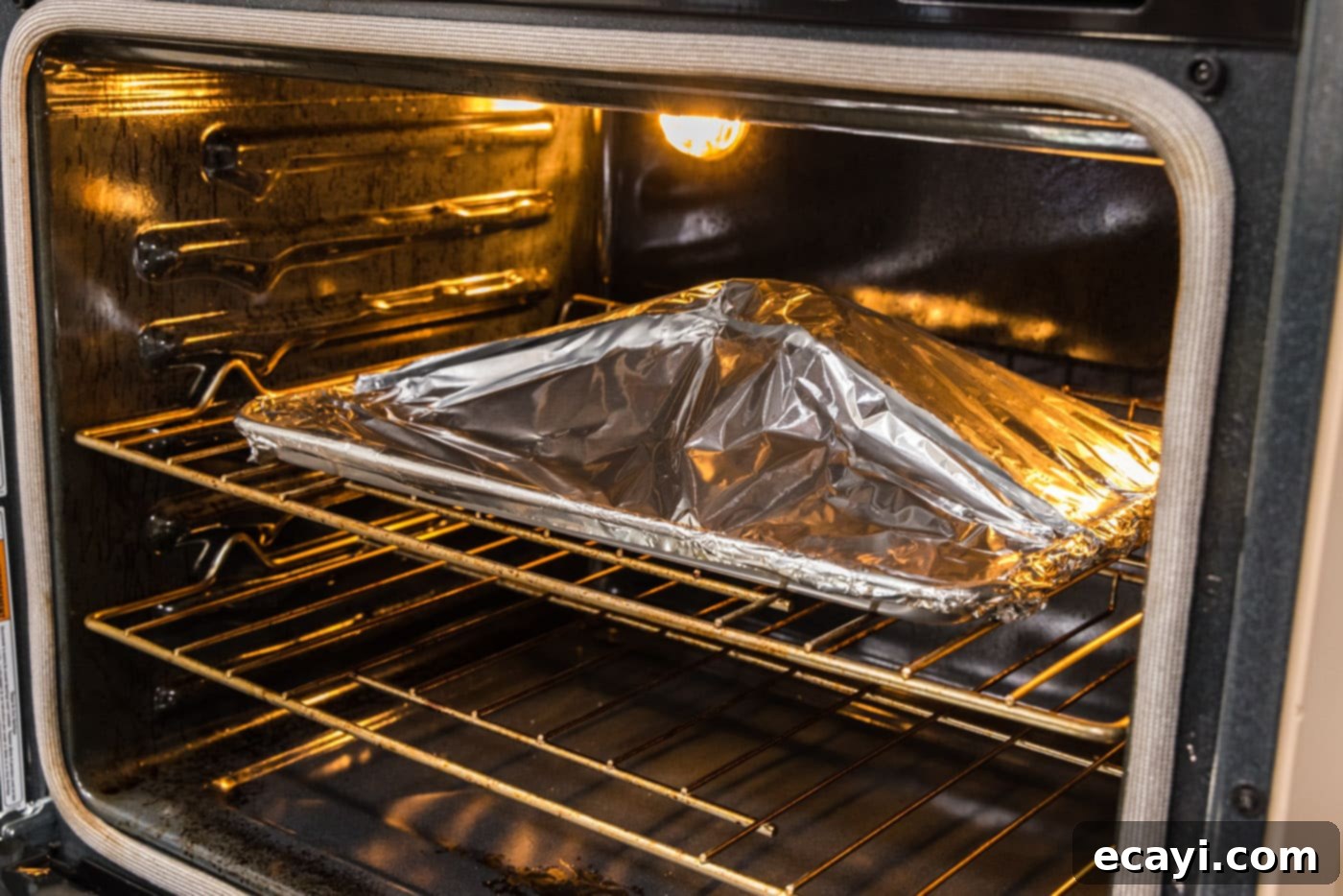 Succulent Lamb Leg Roast 8 roasting leg of lamb in oven with foil