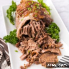 Succulent Lamb Leg Roast 10 Close up photo of Leg of Lamb on a platter half shredded