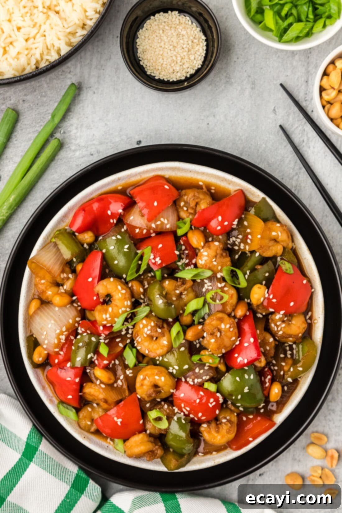 Fiery Wok Shrimp 2 Plate of Kung Pao Shrimp with rice and peanuts on the side, ready to be served for dinner