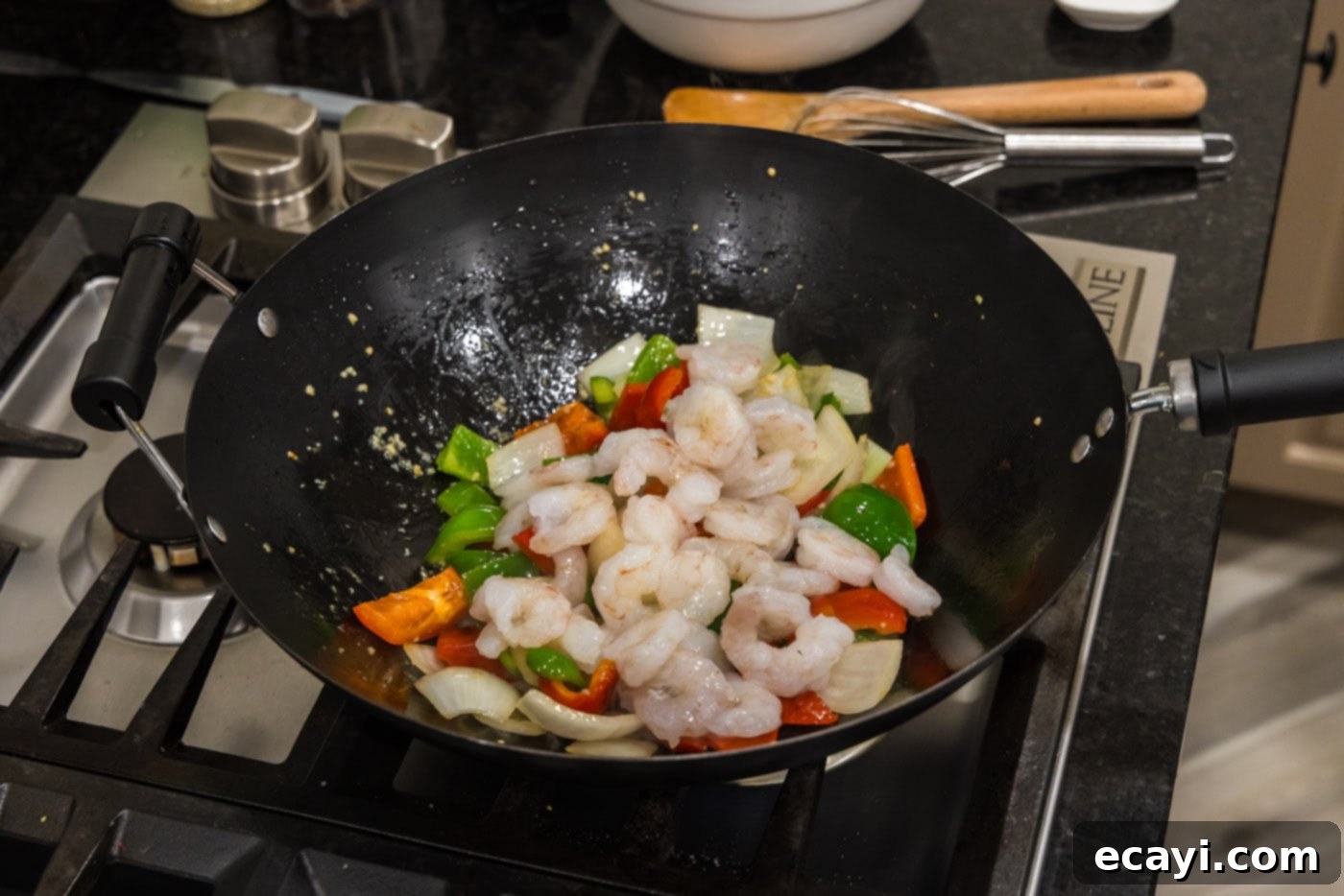 Fiery Wok Shrimp 11 adding shrimp to wok with vegetables