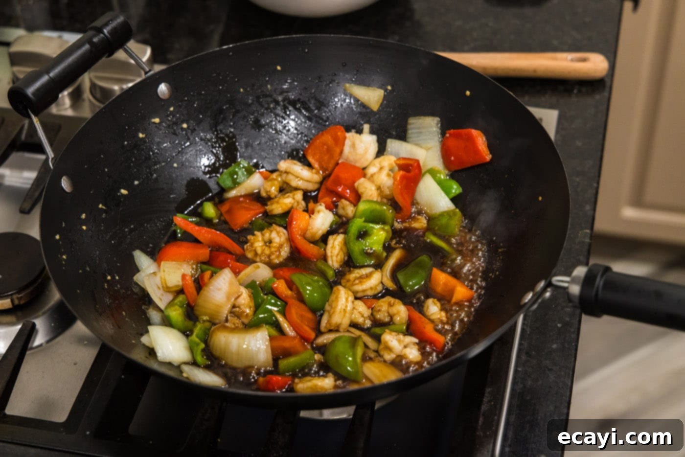 Fiery Wok Shrimp 12 stir frying shrimp with vegetables until cooked