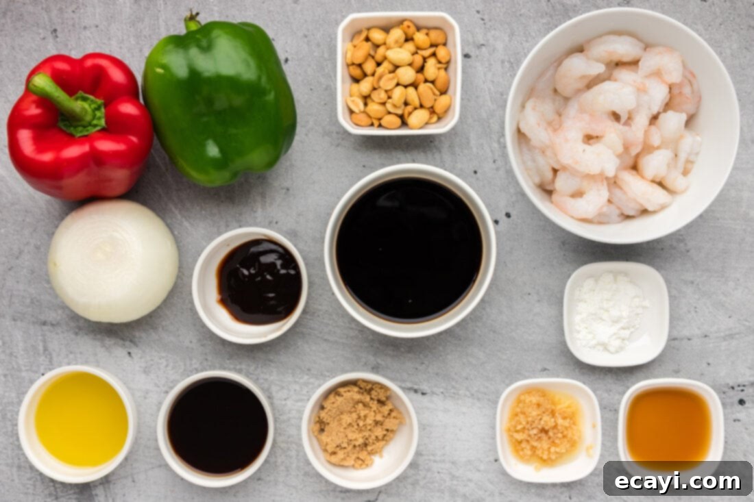 Fiery Wok Shrimp 4 Ingredients for Kung Pao Shrimp laid out on a table, including shrimp, vegetables, and sauce components