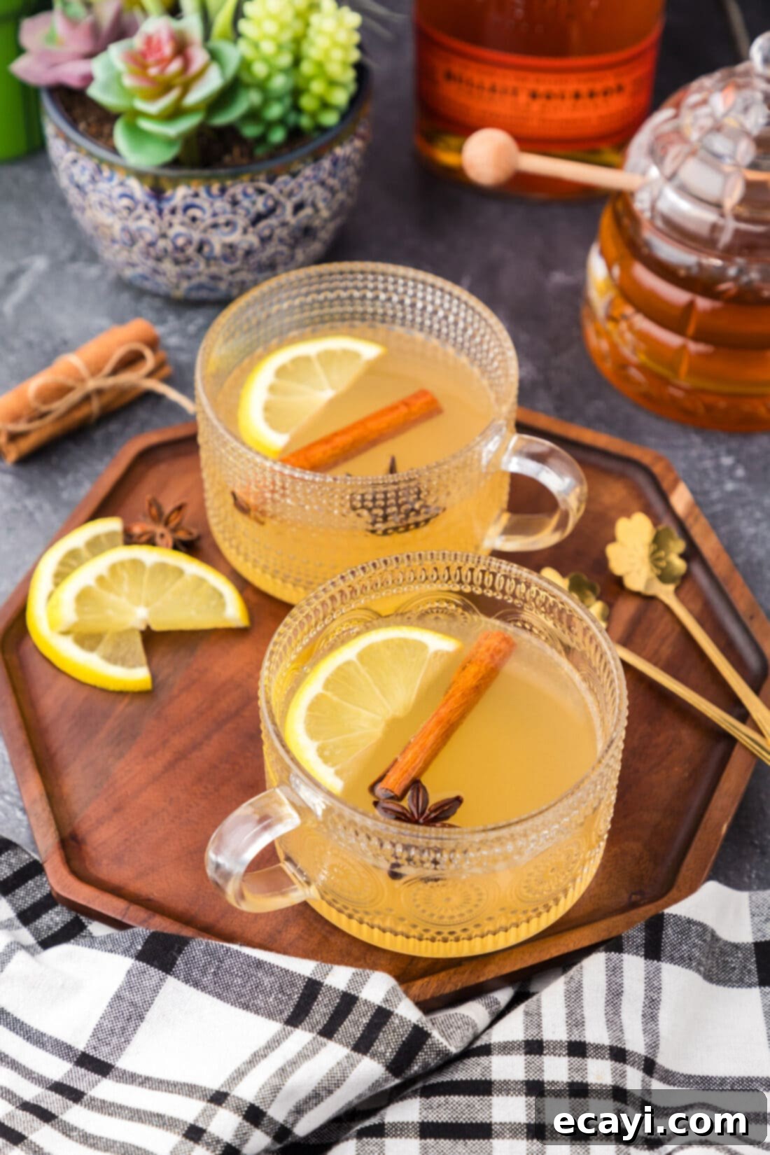Cozy Comfort Brew 3 Two Hot Toddy drinks on a wooden serving tray