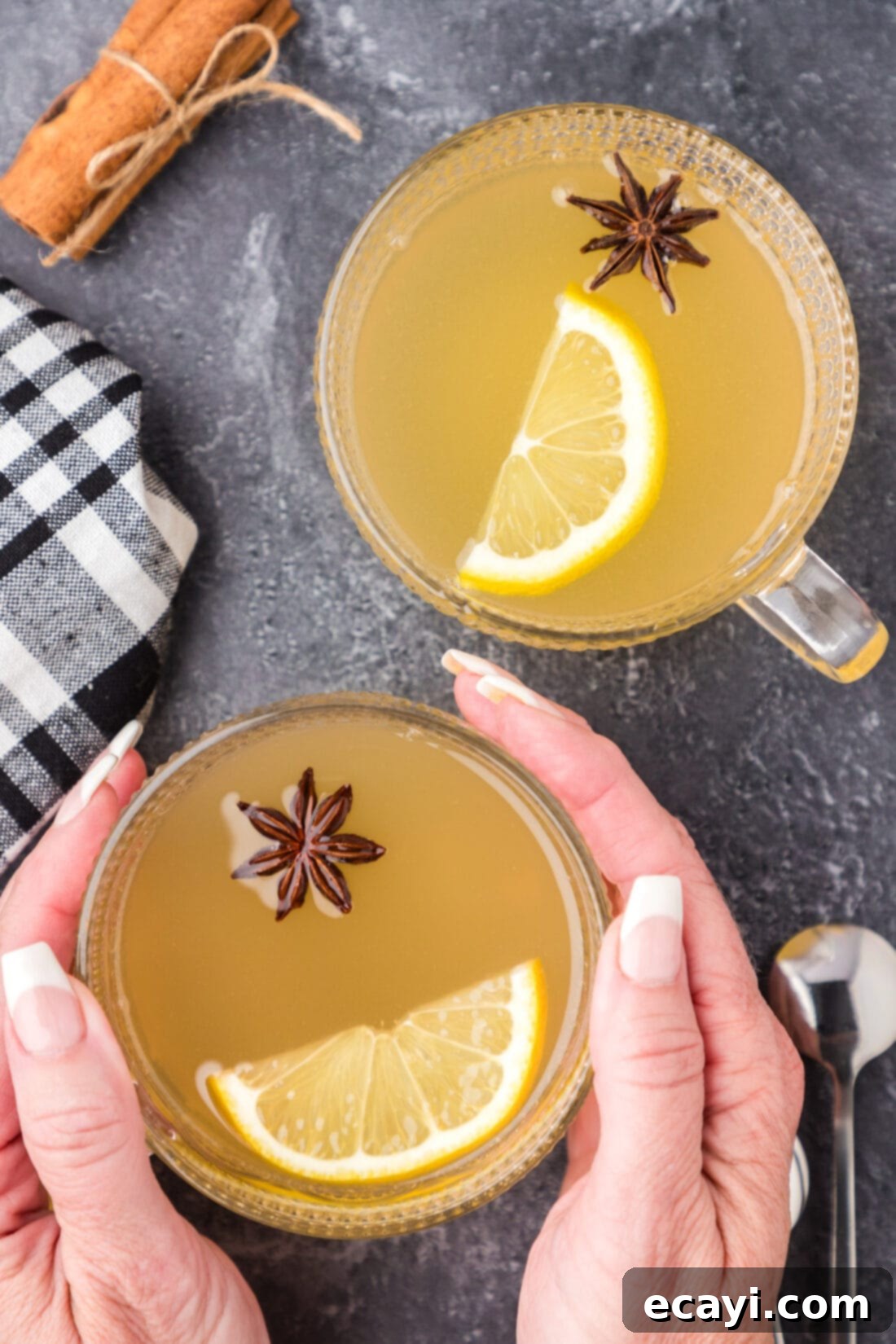 Cozy Comfort Brew 9 Hands holding a Hot Toddy next to another Hot Toddy