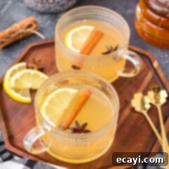 Cozy Comfort Brew 10 Close up photo of two Hot Toddy drinks on a wooden tray