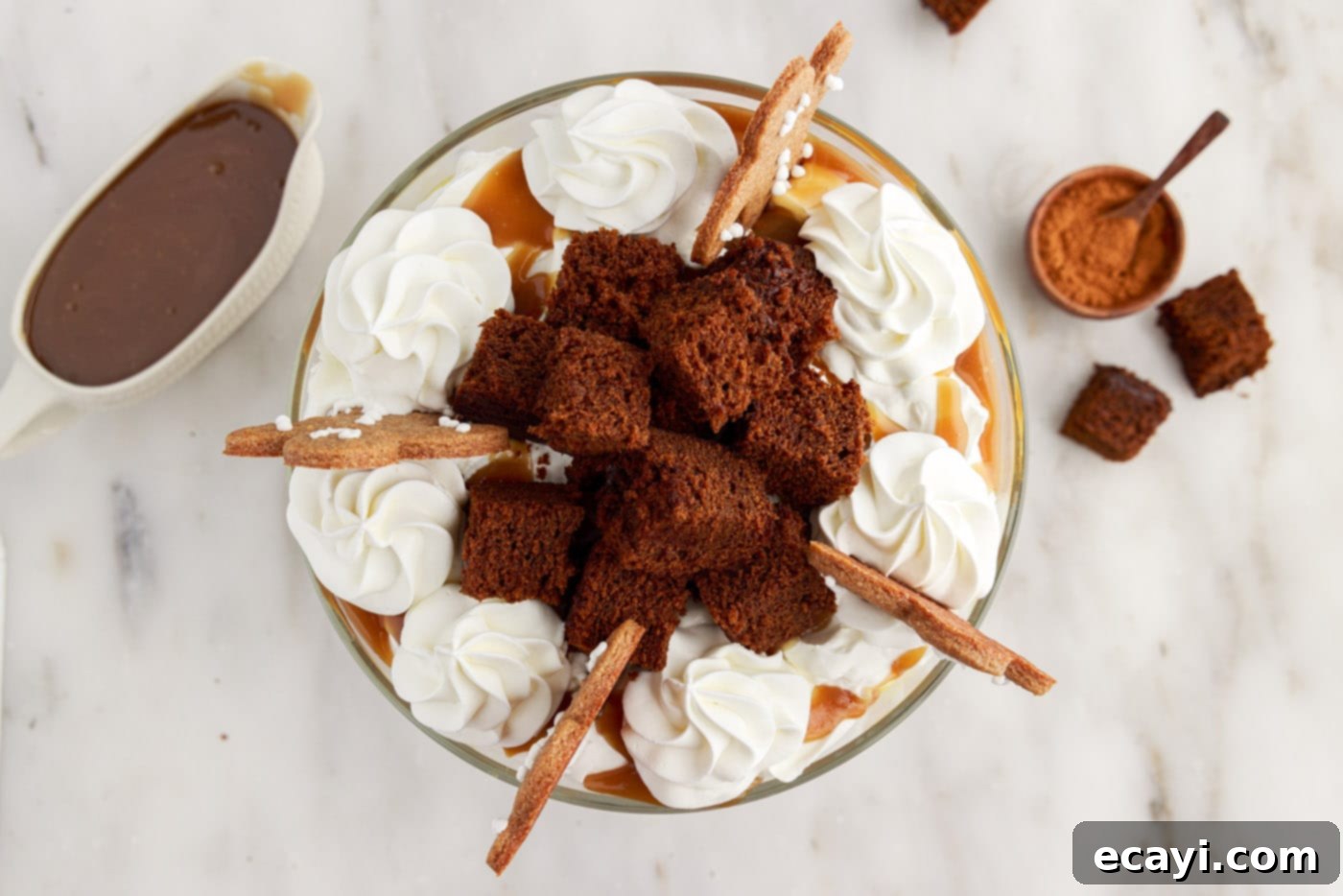 Gingerbread Layered Delight 13 A fully garnished Gingerbread Trifle, topped with gingerbread men cookies and whipped cream swirls