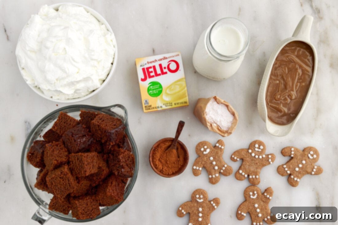 Gingerbread Layered Delight 4 Various ingredients laid out for making Gingerbread Trifle, including cake, pudding mix, and sauces