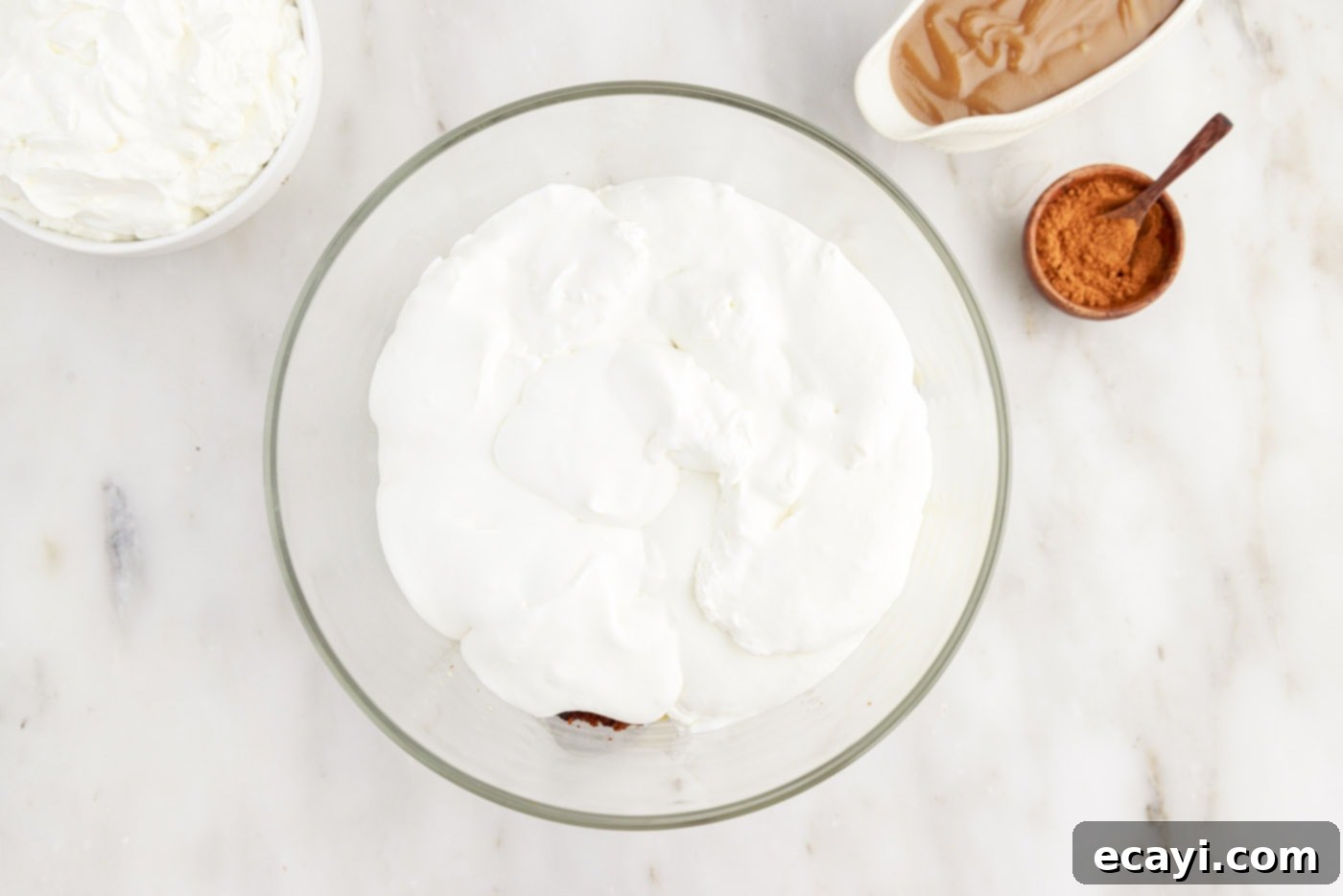 Gingerbread Layered Delight 9 A smooth layer of whipped cream covering the pudding and gingerbread cake in the trifle
