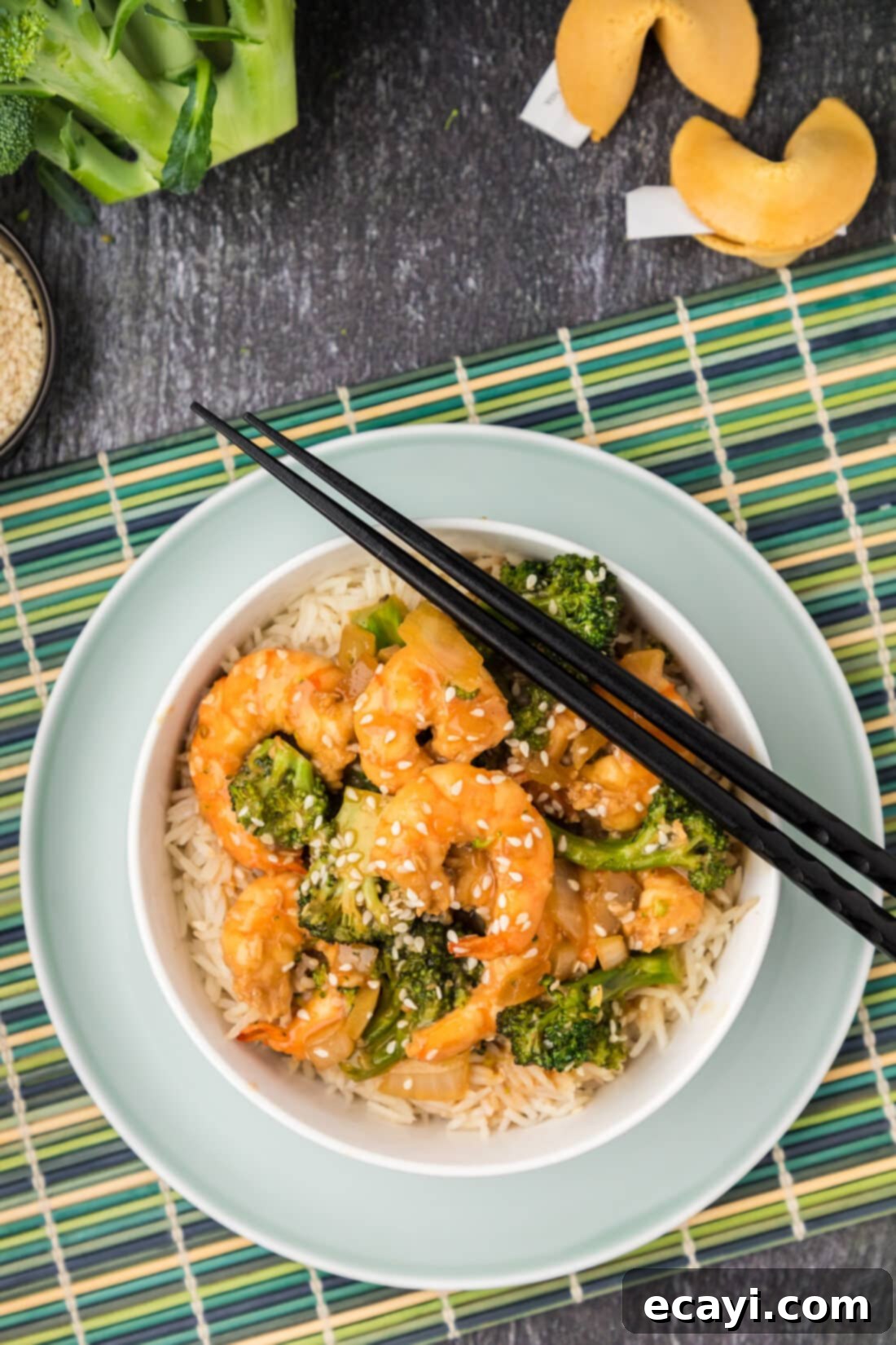 Garlic Shrimp & Broccoli Sauté 2 Bowl of Shrimp and Broccoli with chopsticks on the side, ready to be eaten