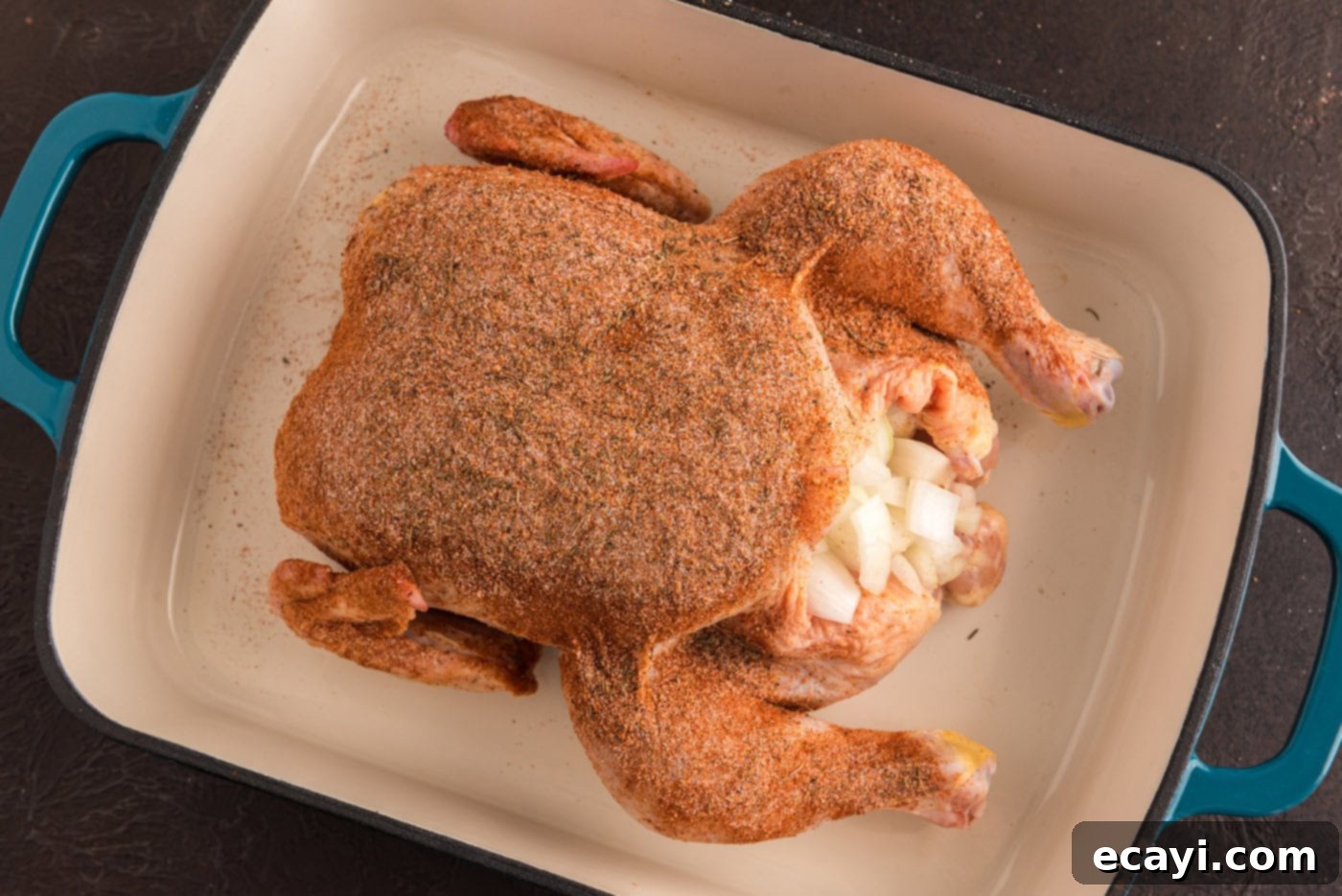 Slow Roasted Caramelized Chicken 6 whole chicken rubbed with seasonings and stuffed with onions