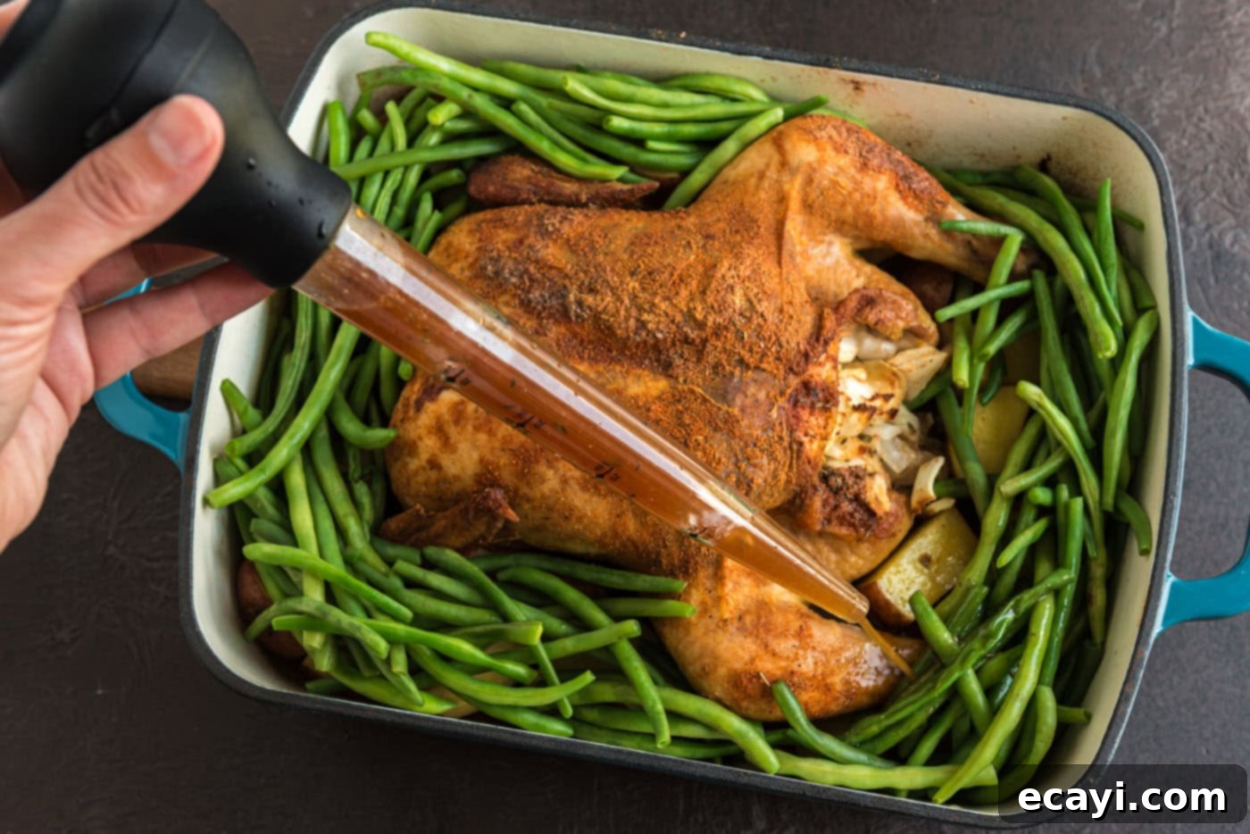 Slow Roasted Caramelized Chicken 10 basting chicken and green beans in a roasting pan