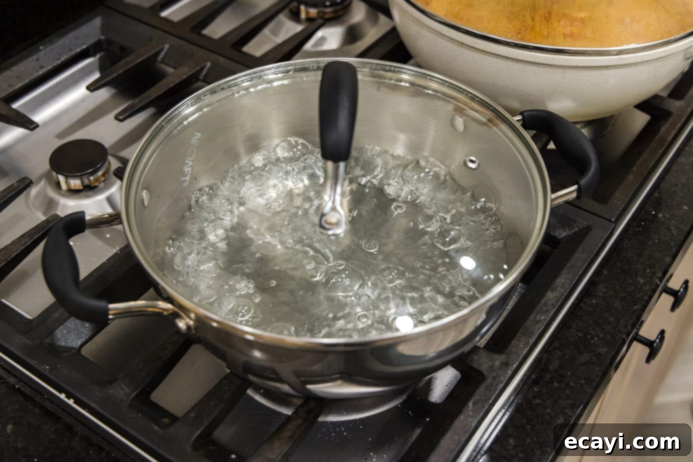 Perfectly Steamed Spinach 5 Boiling water in a steam pot, creating steam for cooking