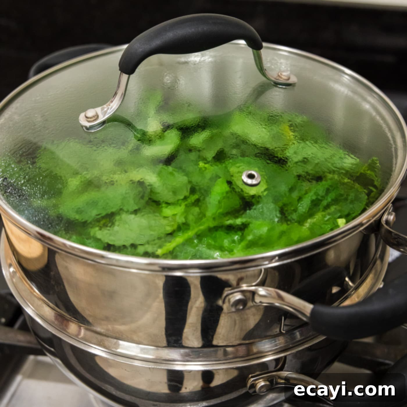 Perfectly Steamed Spinach 7 Steaming spinach in a pot, showing the process of wilting