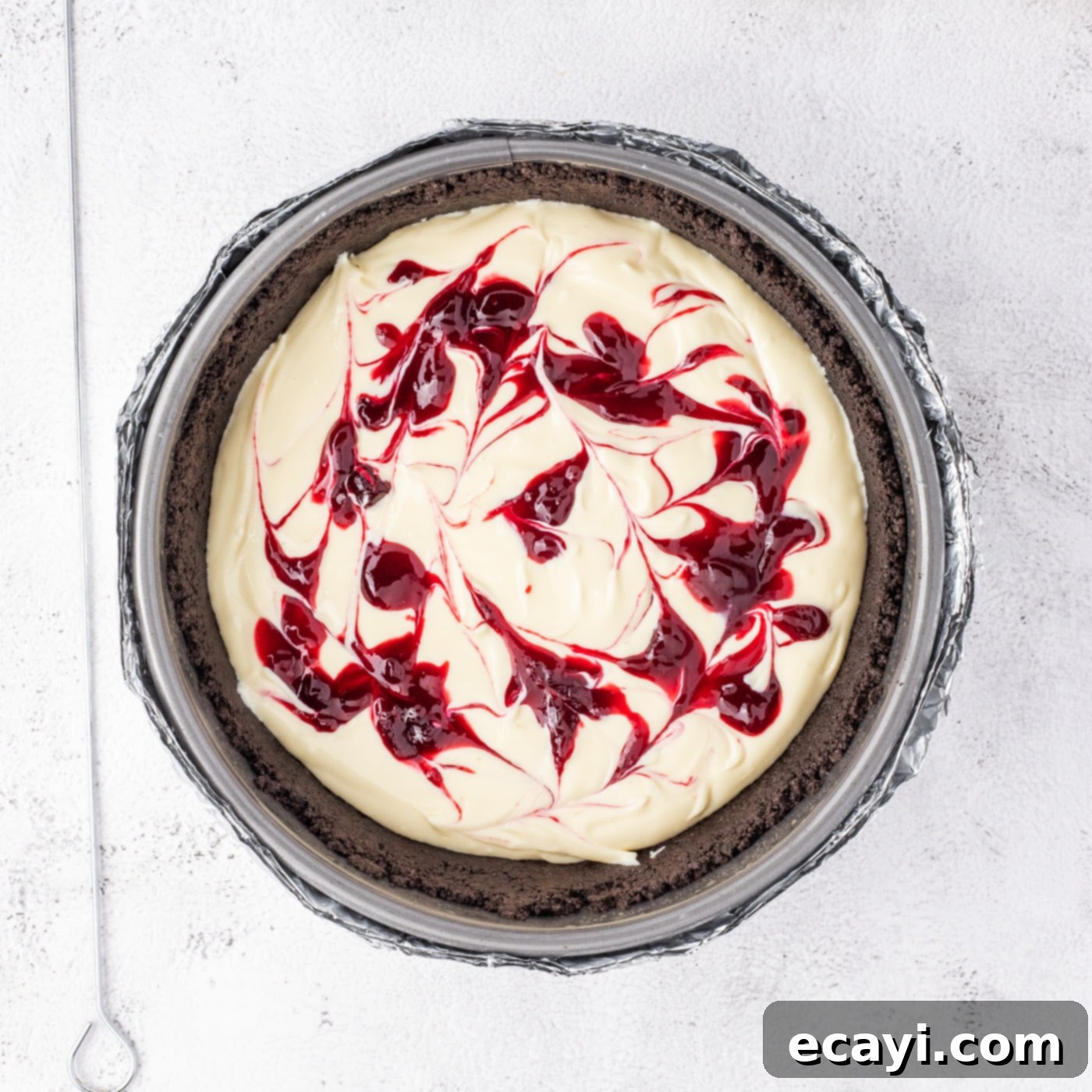 Blackberry Swirl Cheesecake 14 swirled blackberry reduction on top of cheesecake batter
