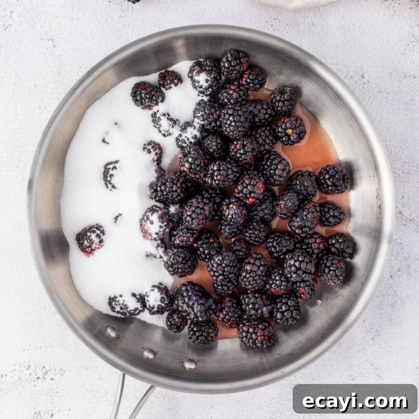 Blackberry Swirl Cheesecake 5 blackberries, sugar, and fruit nectar in a saucepan