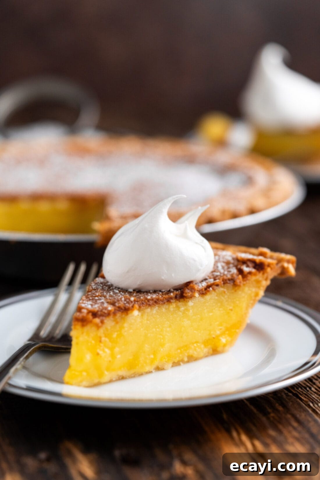 Sweet & Buttery Chess Pie 2 Slice of Chess Pie on a plate topped with whipped cream