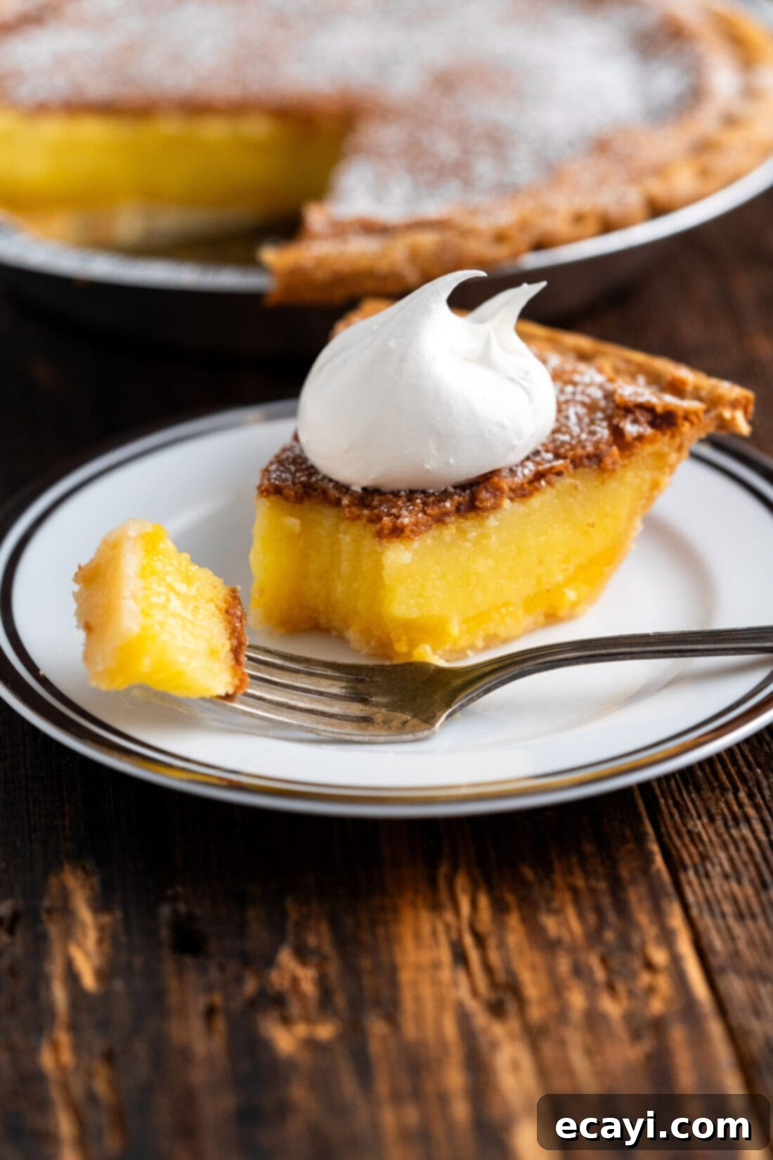 Sweet & Buttery Chess Pie 11 Slice of Chess Pie on a plate with a bite on a fork