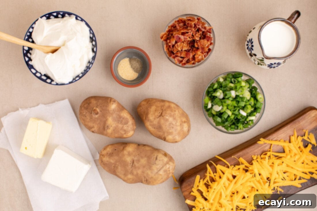 Loaded Cheesy Potato Casserole 4 Various fresh ingredients for Twice Baked Potato Casserole including russet potatoes, cream cheese, sour cream, milk, butter, garlic powder, ground pepper, cheddar cheese, bacon, and green onions