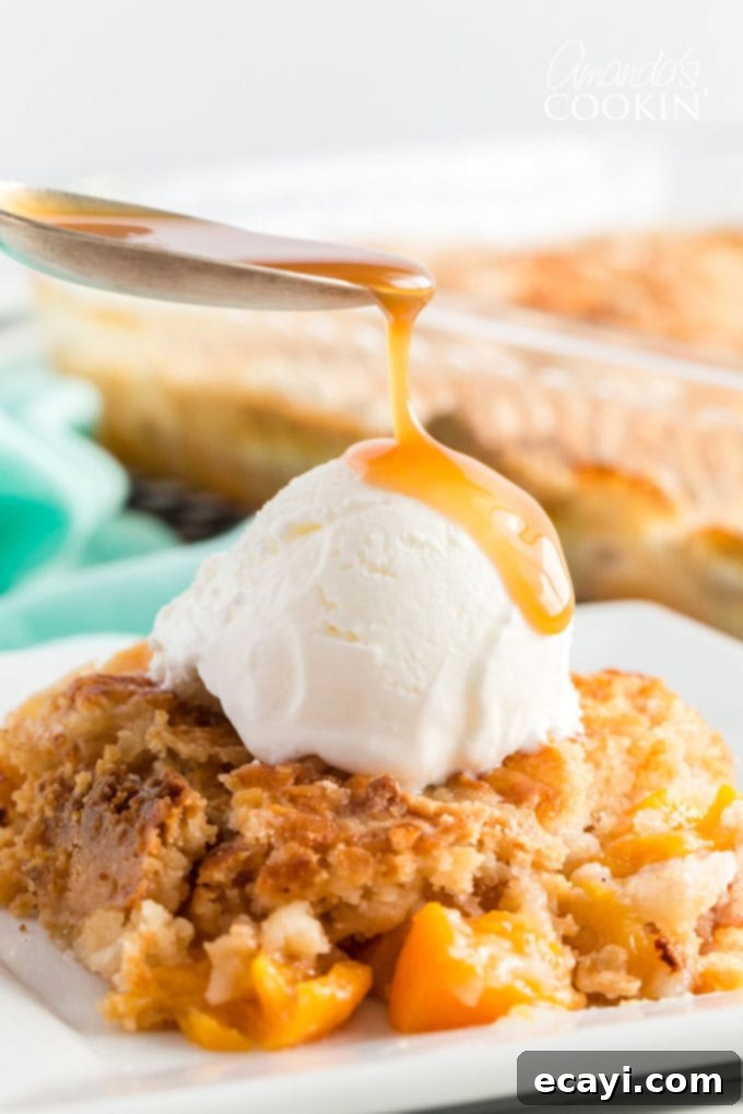 Effortless Peach Cobbler Bake 2 spoon dripping caramel onto ice cream on peach cobbler dump cake