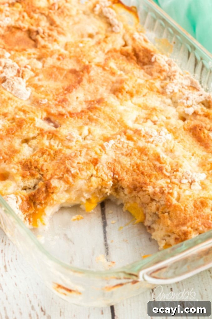 Effortless Peach Cobbler Bake 3 pach dump cake with a slice out of it