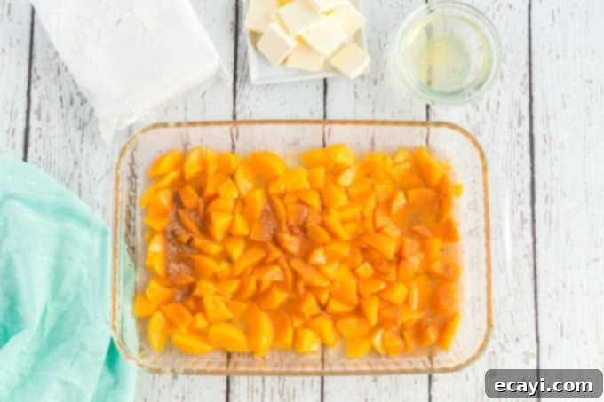 Effortless Peach Cobbler Bake 6 peaches in a pan