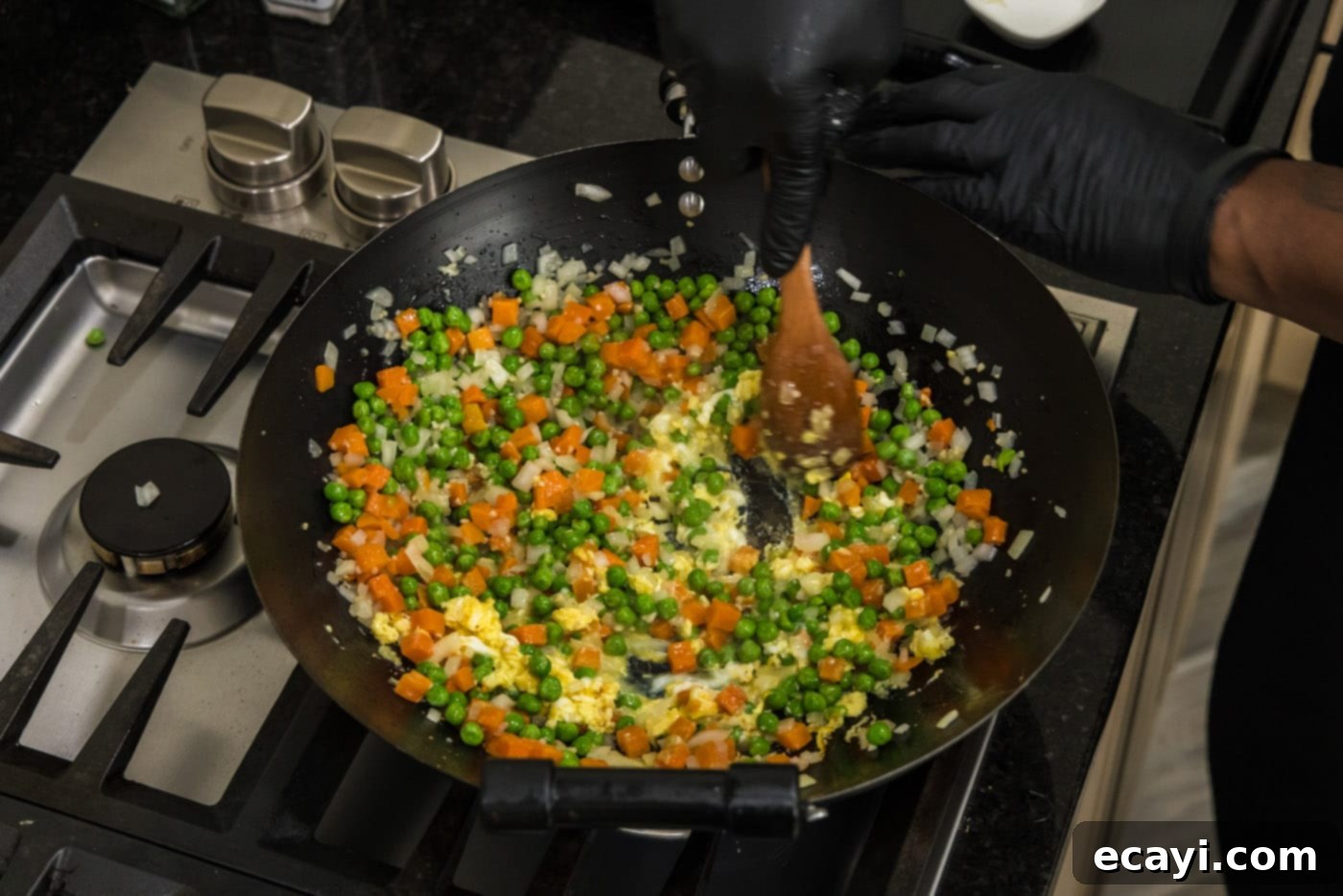 Golden Shrimp Fried Rice 11 stirring cooked egg into stir fry vegetables