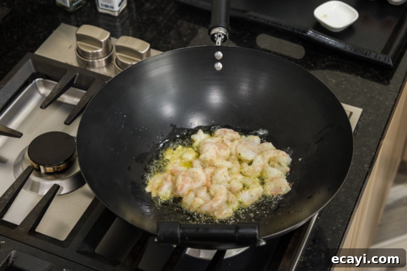 Golden Shrimp Fried Rice 6 cooking shrimp in a wok with oil